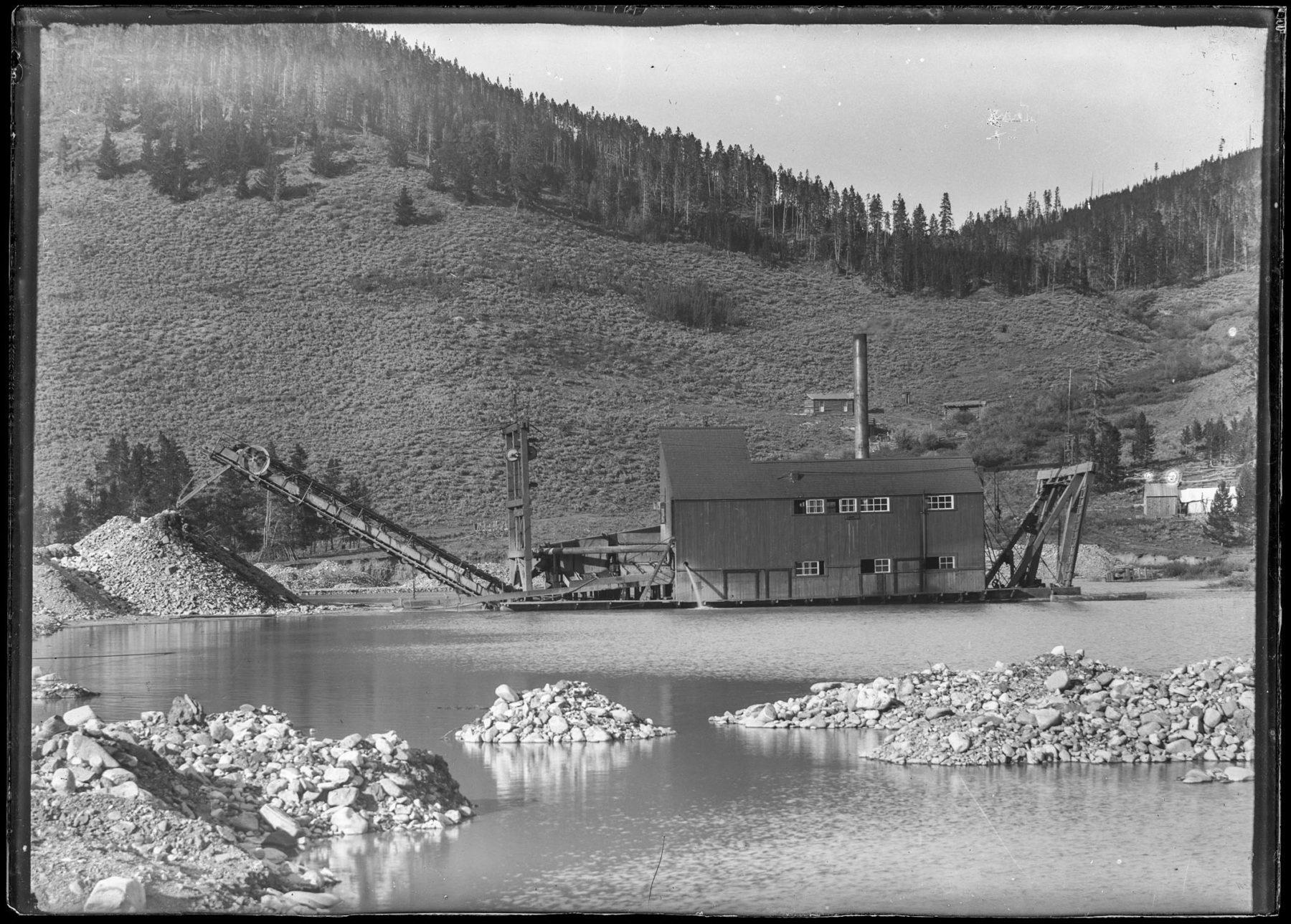 Breckenridge and southern Summit County experienced three mining booms.  The first, lasting from 1859 until the mid-1860s, brought prospectors who looked for the “easy” gold--the nuggets in streams, the pieces laying on the ground and buried in shallow soils on the hillsides.  They used pans, rocker boxes, long toms, and later high pressure hoses called “giants” to wash the gold-filled soil into sluice boxes.  The second boom, the hard rock mining boom, began in the 1870s.  Rather than the individual prospector chasing his dream, companies hired miners and others to work the mines.